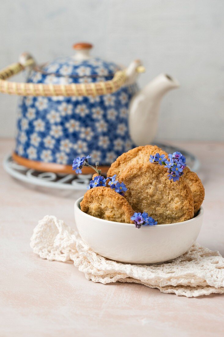 Oat biscuits with forget-me-nots and a teapot