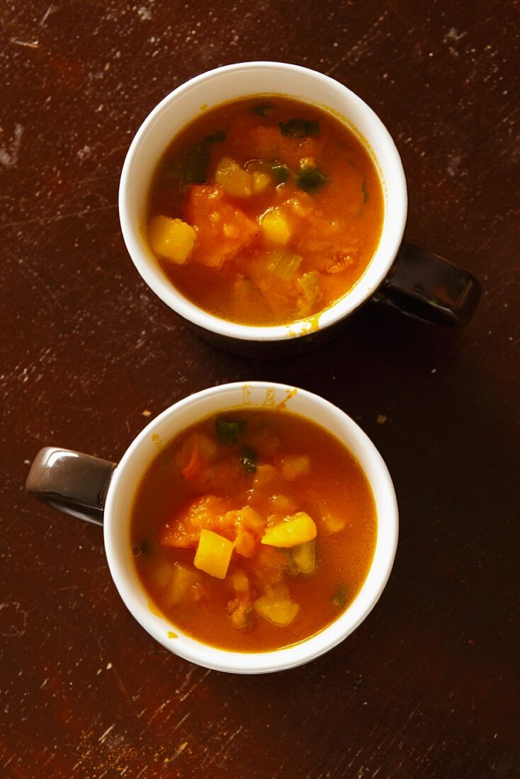 Vegetable soup with pumpkin served in cappuccino cups
