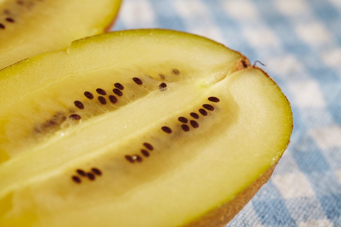 A golden kiwi (halved, close-up)