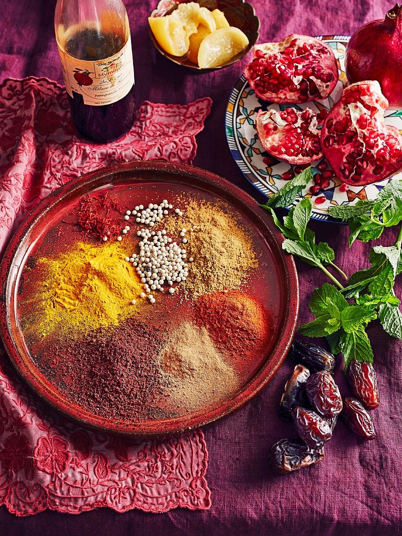 Moroccan spices - Saffron, ground cummin, ground coriander, ground sumac, pomegranate, preserved lemon, dates, Fresh mint leaves
