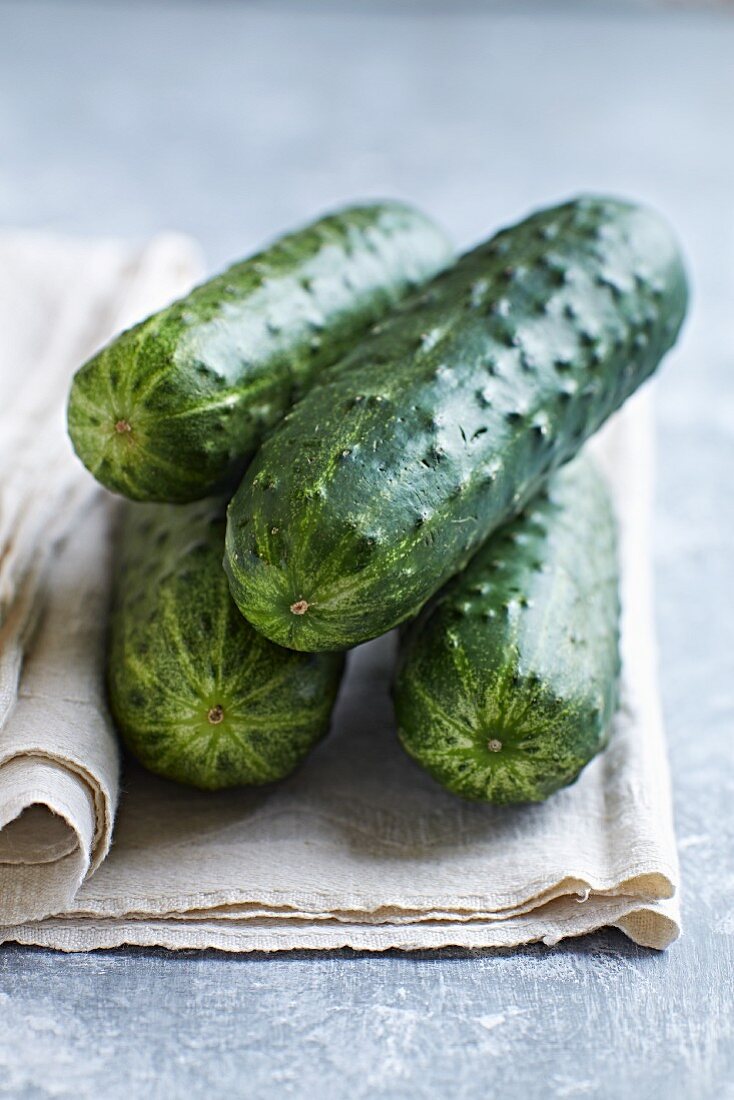 Fresh cucumbers on a linen cloth