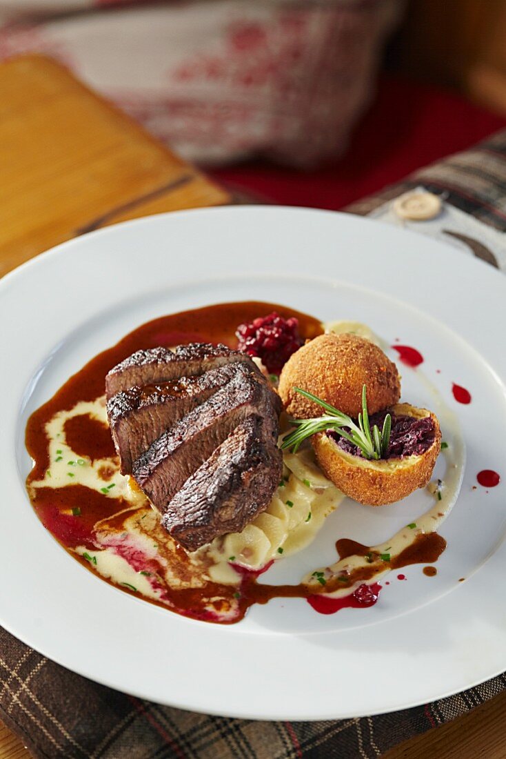 Roasted saddle of veal with black salsify ragout and baked red cabbage dumpling (Austria)