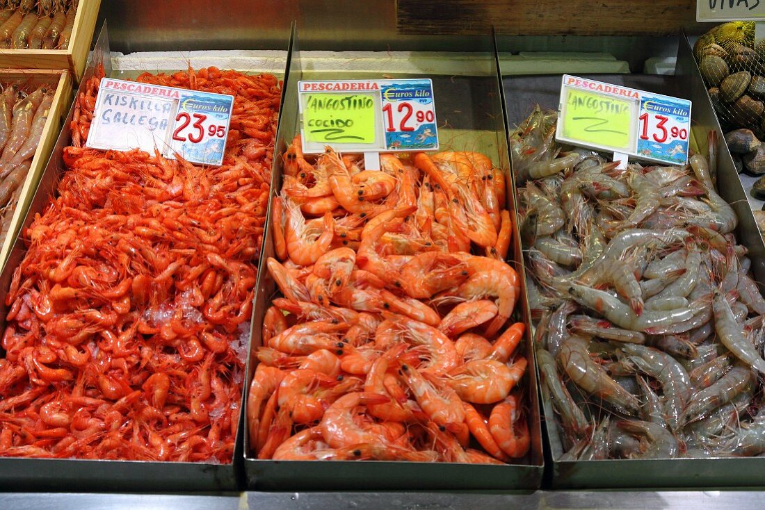 Prawns from Galicia and langoustines (raw and cooked) at the fish market in Bilbao, Basque Country, Spain