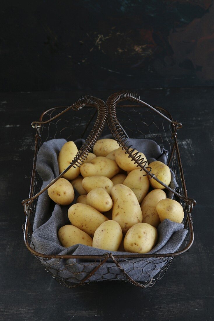New potatoes in a wire basket