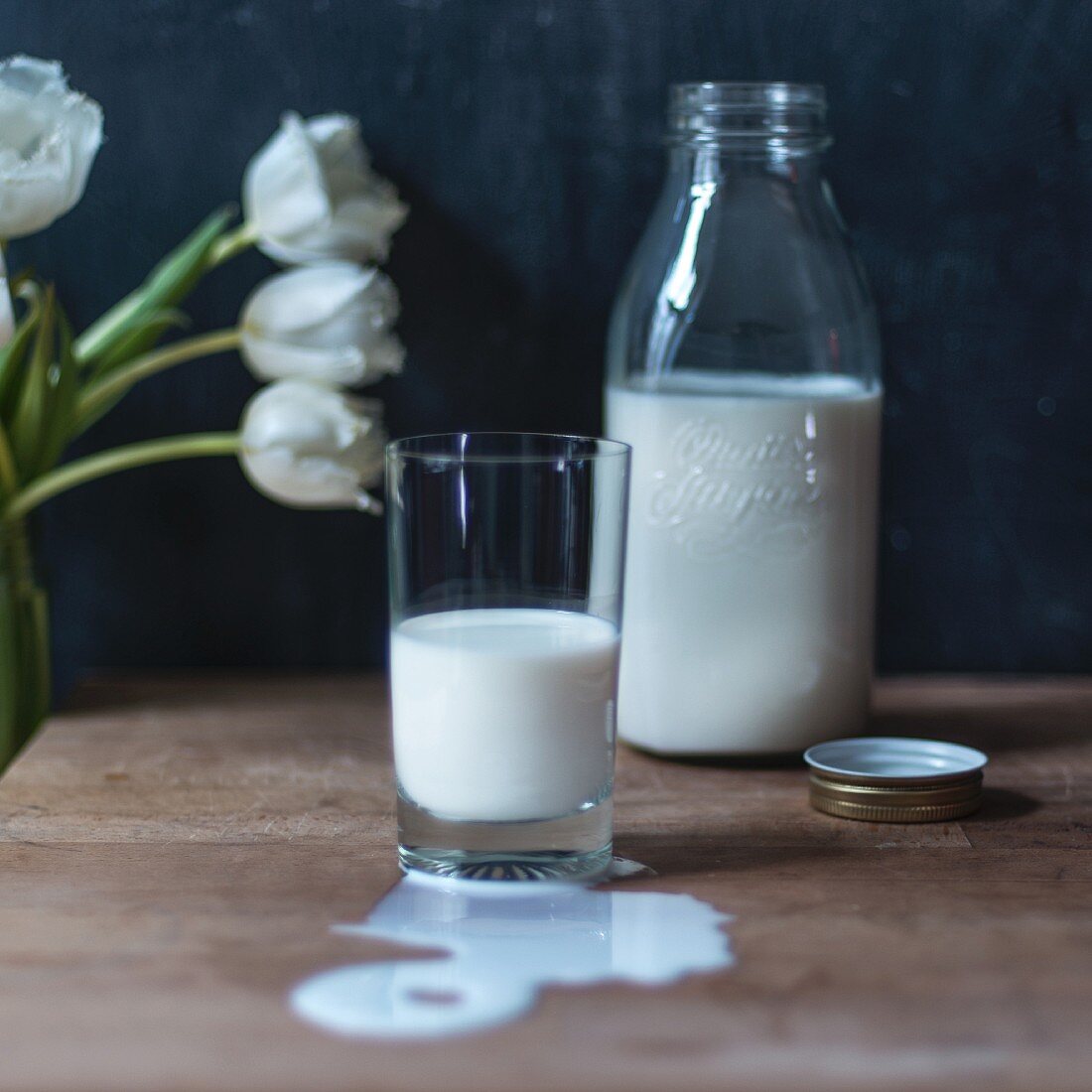 Milk in a glass and in a bottle