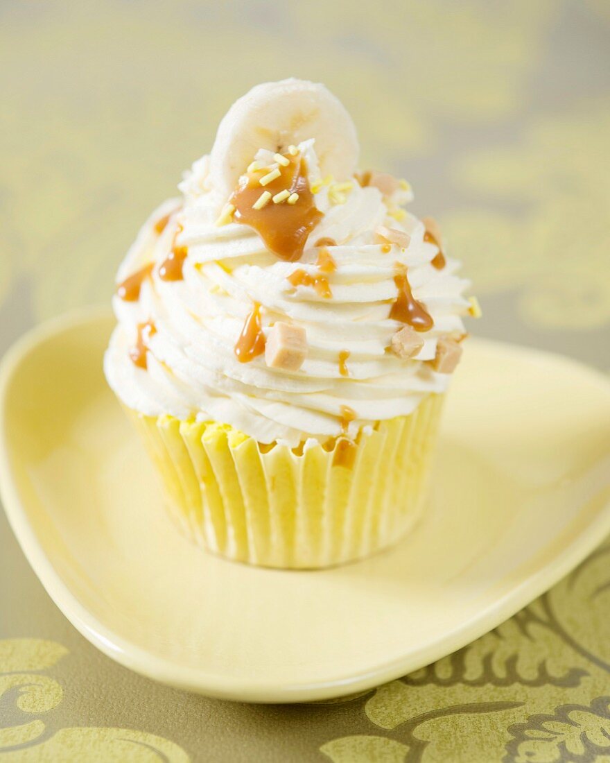 A banoffee cupcake with caramel drizzle