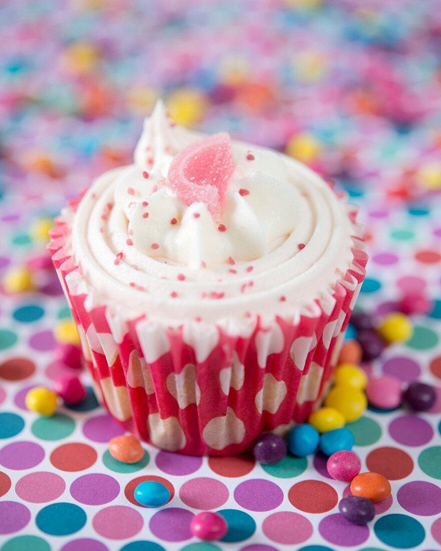 A vanilla and strawberry cupcake