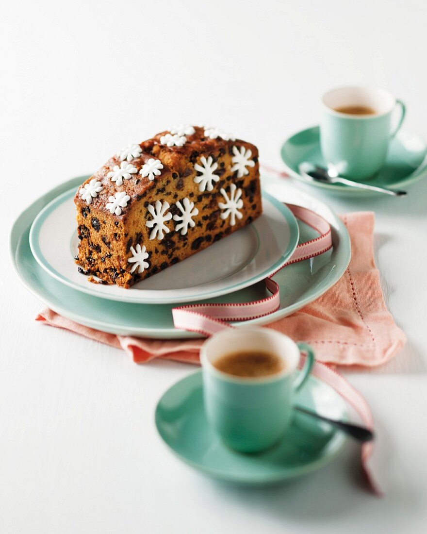 A slice of fruit cake decorated with sugar stars