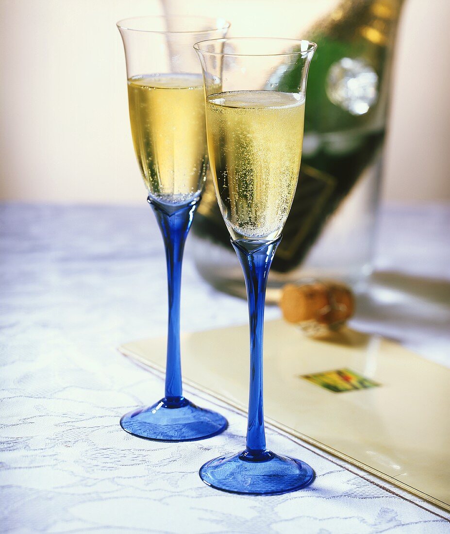 Champagne in Blue Flute Glasses