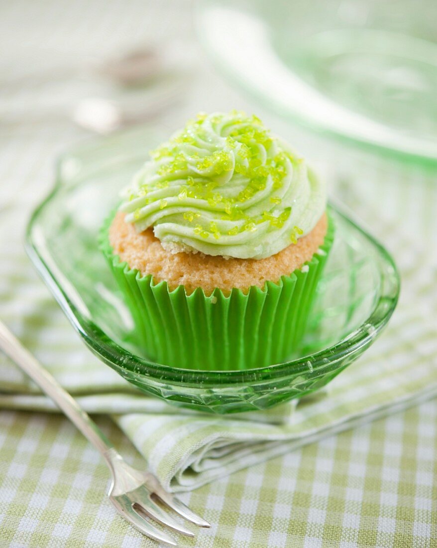 A citrus cupcake with green sugar