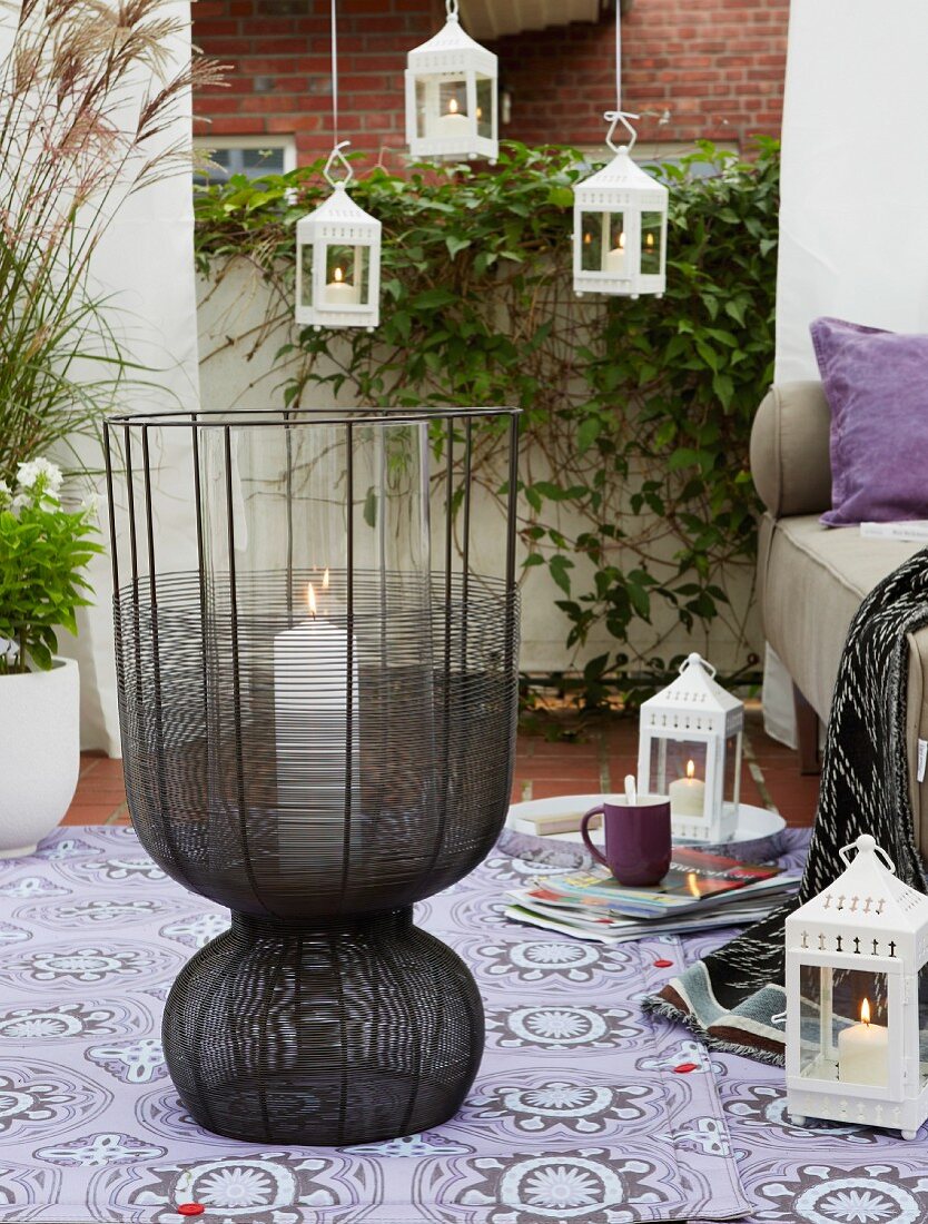 Lots of little lanterns and a large lantern on an oriental-stlye terrace