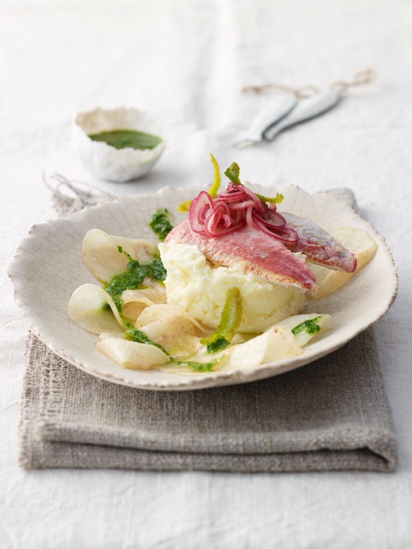 Lime-steamed red mullet fillet with mint salsa verde on roasted kohlrabi slices and sour cream mashed potatoes