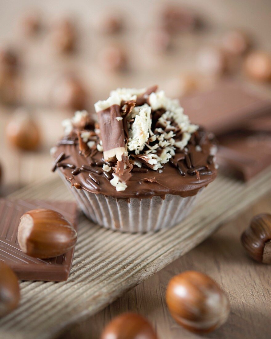 A chocolate cupcake with hazelnuts