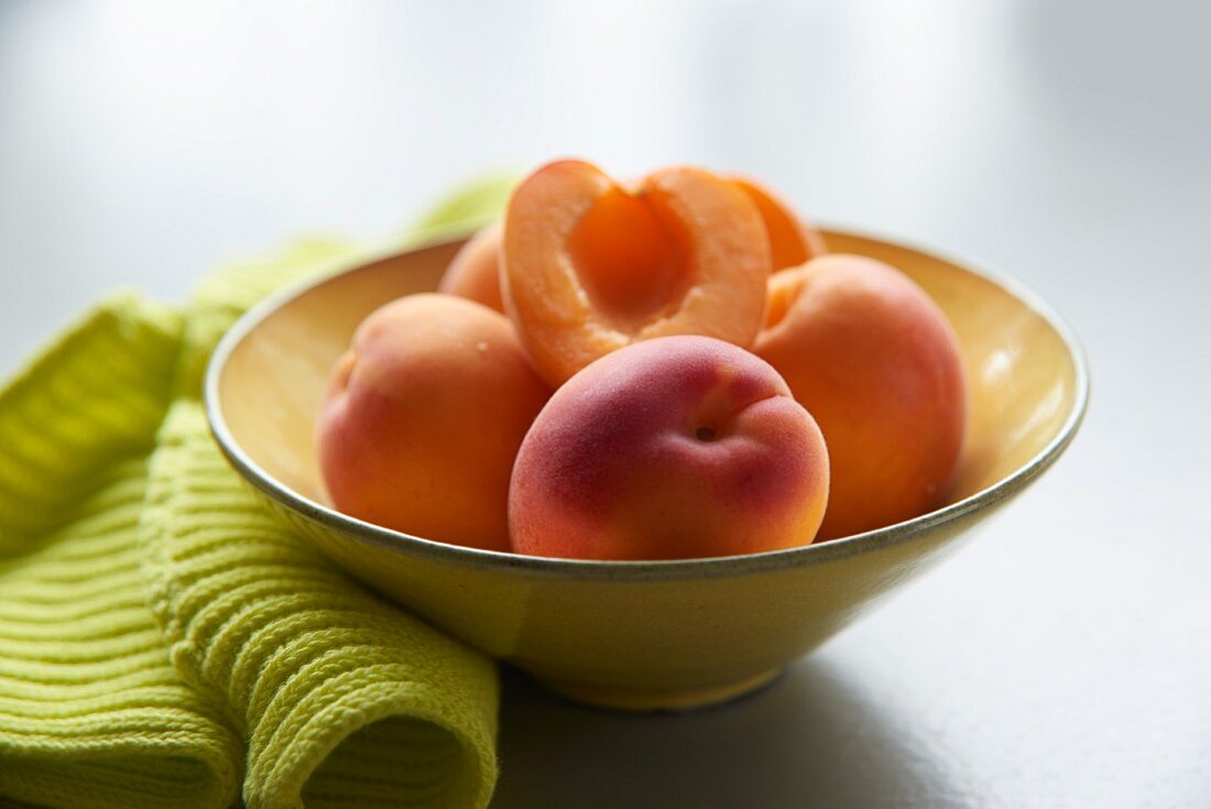 Apricots in a yellow bowl