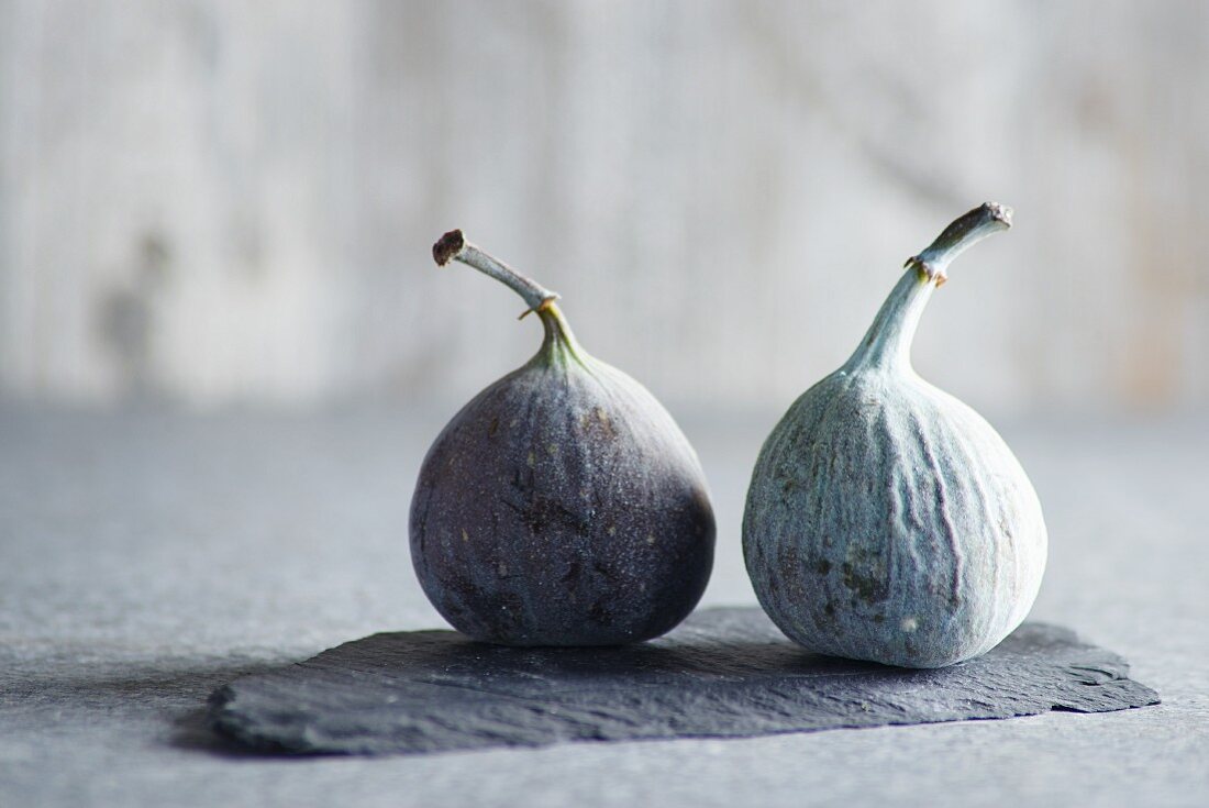 Two figs on a piece of slate