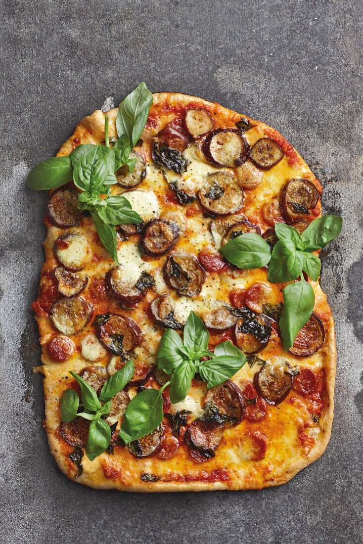 A pizza with aubergines soaked in Chardonnay