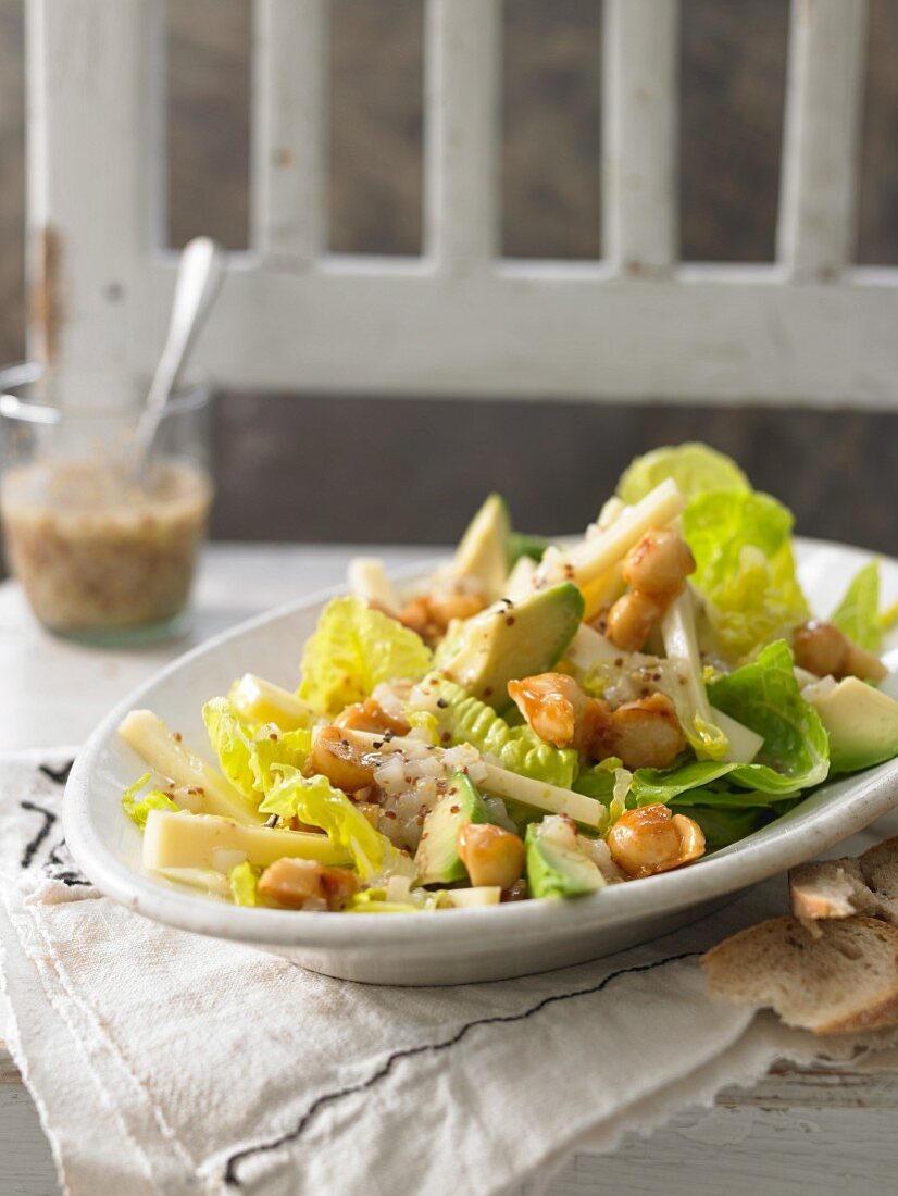Cheese salad with Senner cheese, avocado and caramelised macadamia nuts in a pear dressing