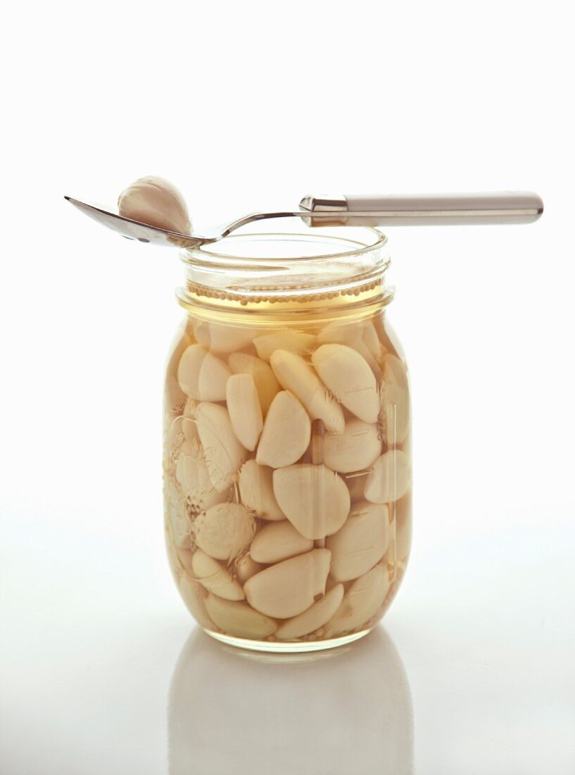 A jar of pickled garlic cloves