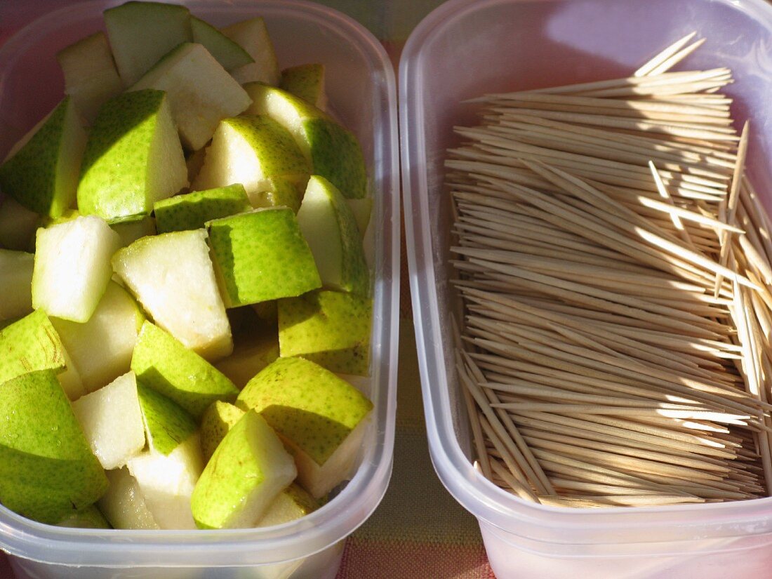 Diced pears and toothpicks for tasting at a market