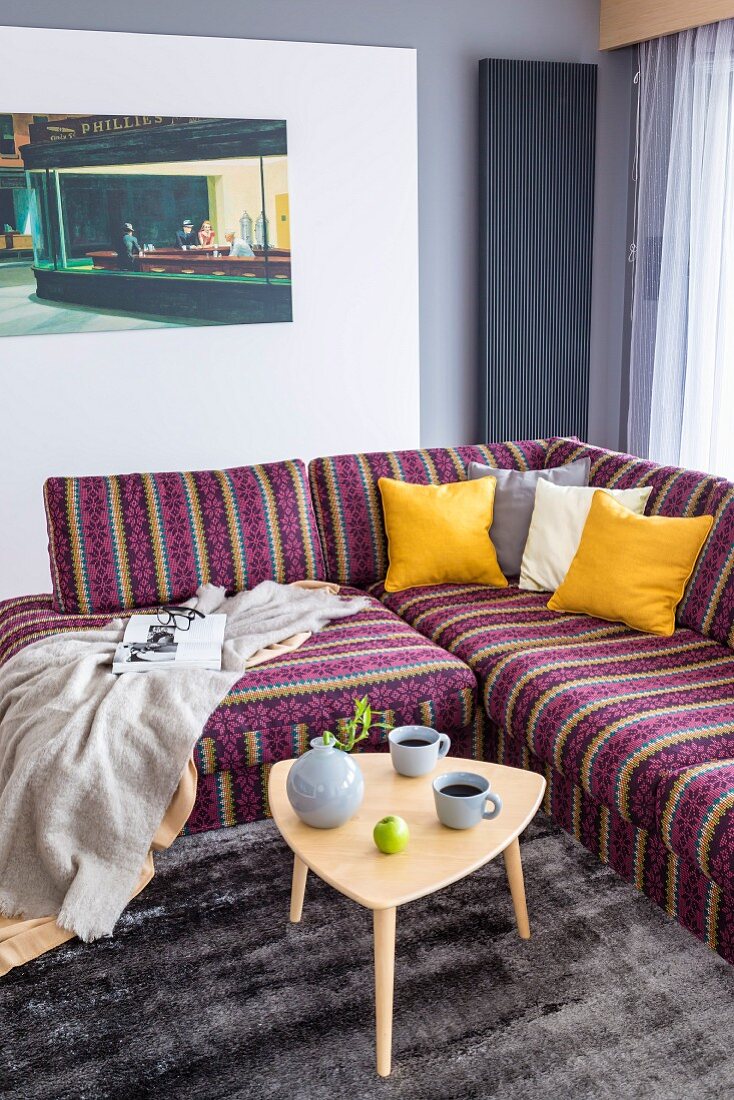 Striped corner sofa and retro side table