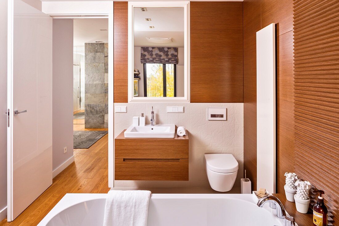 Designer-style, wood-clad ensuite bathroom