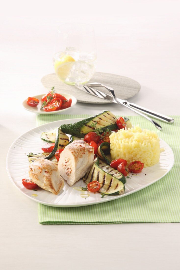 Stuffed turkey breast with courgette, tomatoes and rice timbale