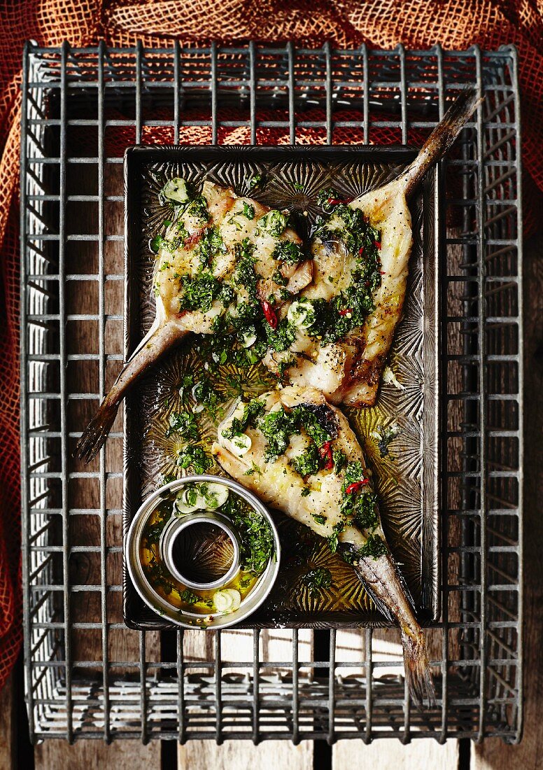 Fish with garlic, chilli and salsa verde (seen from above)