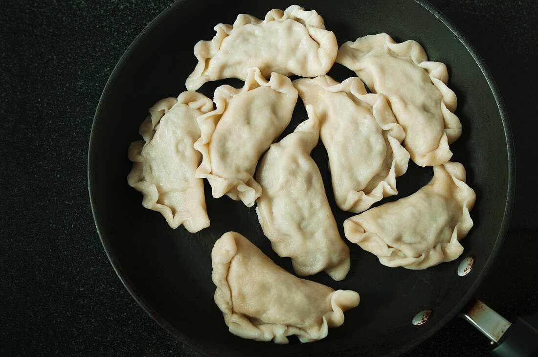 Cooked pierogi (meat-filled pastry dumpling, Poland) in a frying pan
