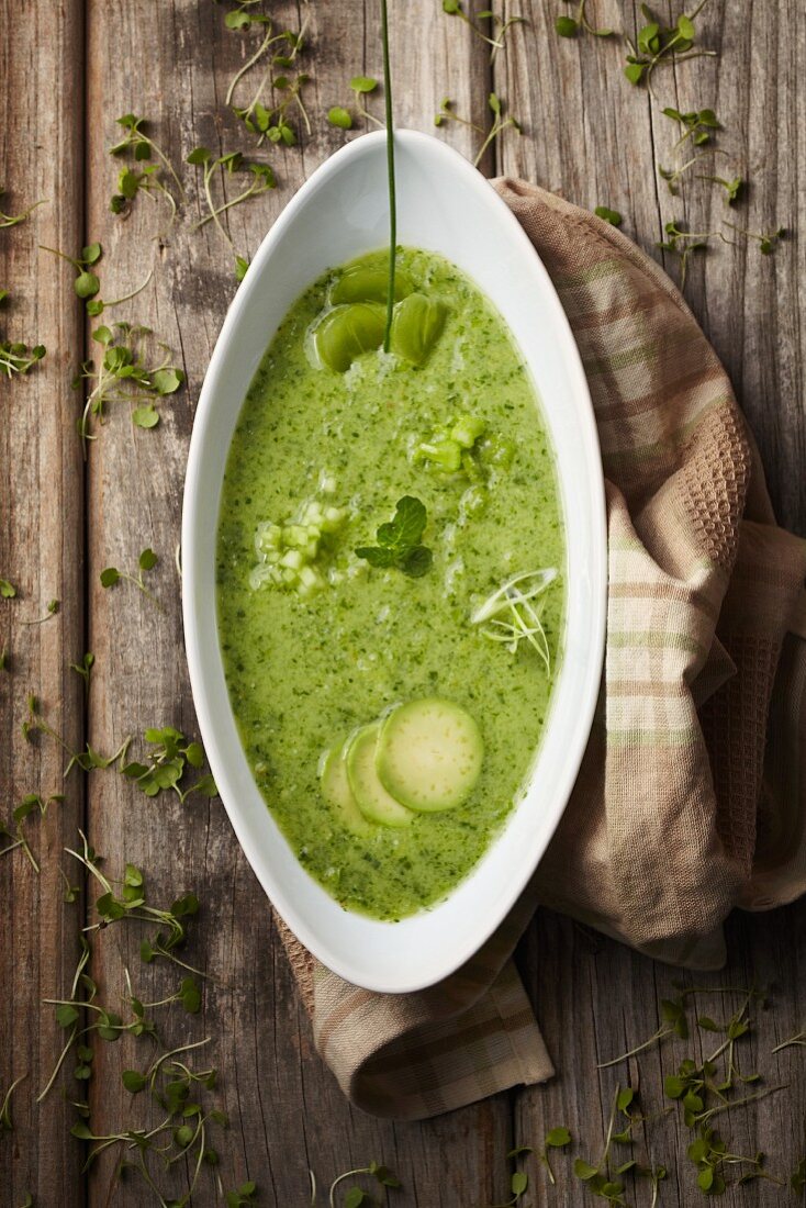 Cream of green vegetable soup with herbs (seen from above)