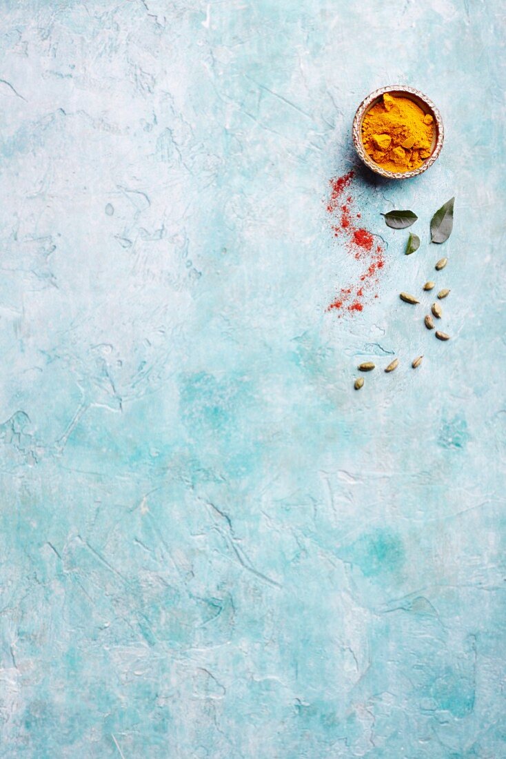 Spices on a blue surface