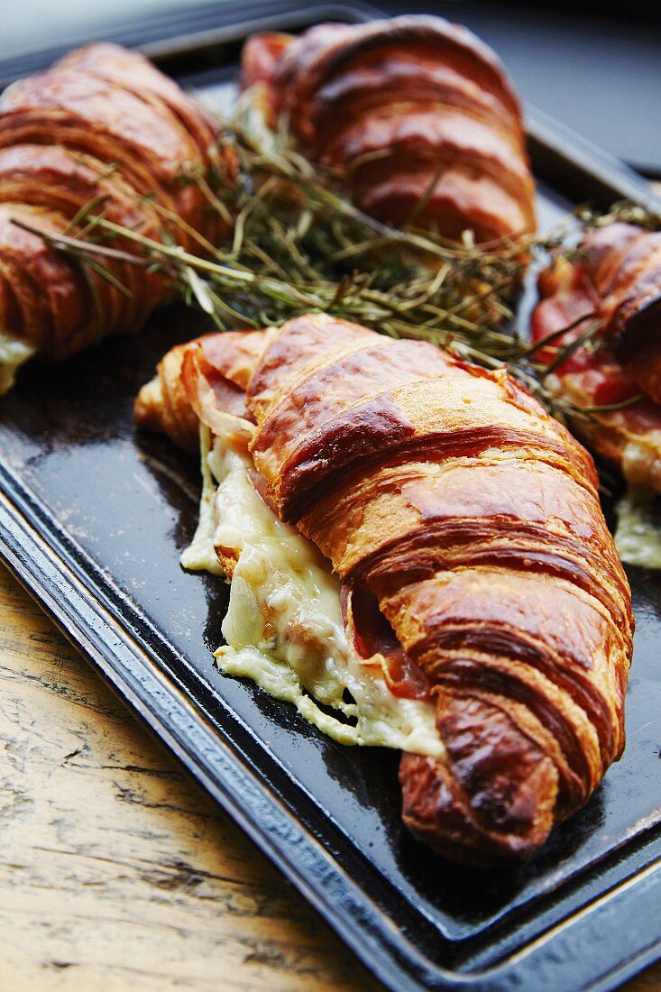 Gratinated croissants filled with cheese and ham