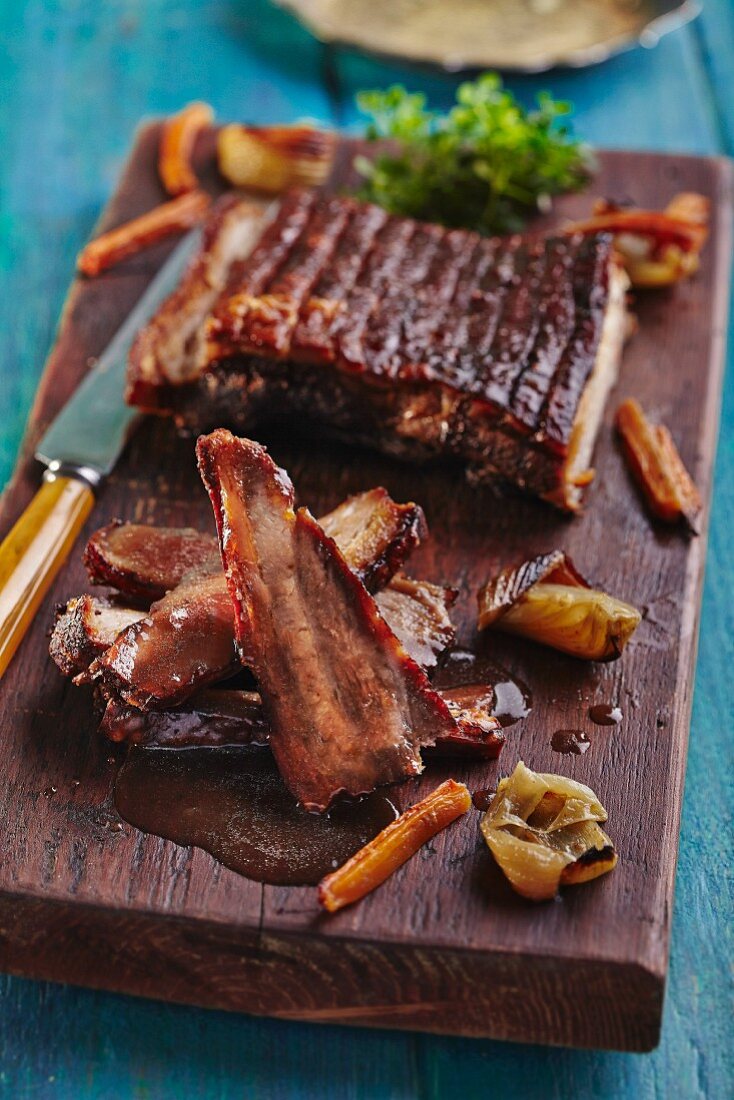 Spare ribs on a wooden board
