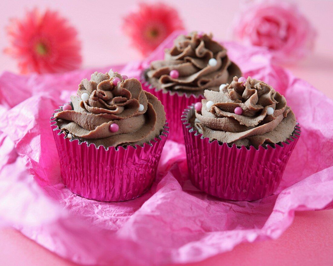 Chocolate cupcakes with coloured sugar pearls