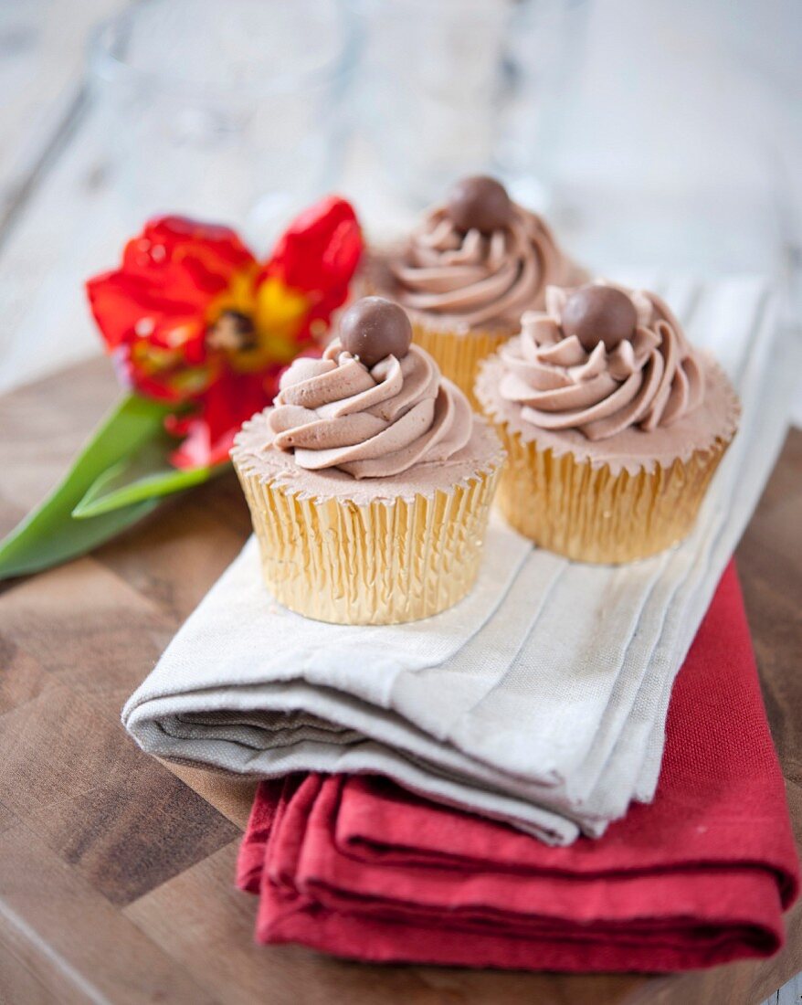 Cupcakes decorated with chocolate mousse and Malteasers