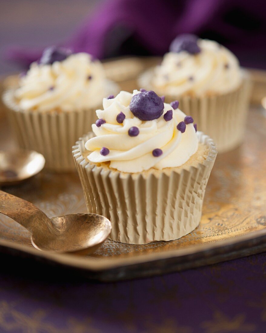Vanilla cupcakes with blackcurrant cream