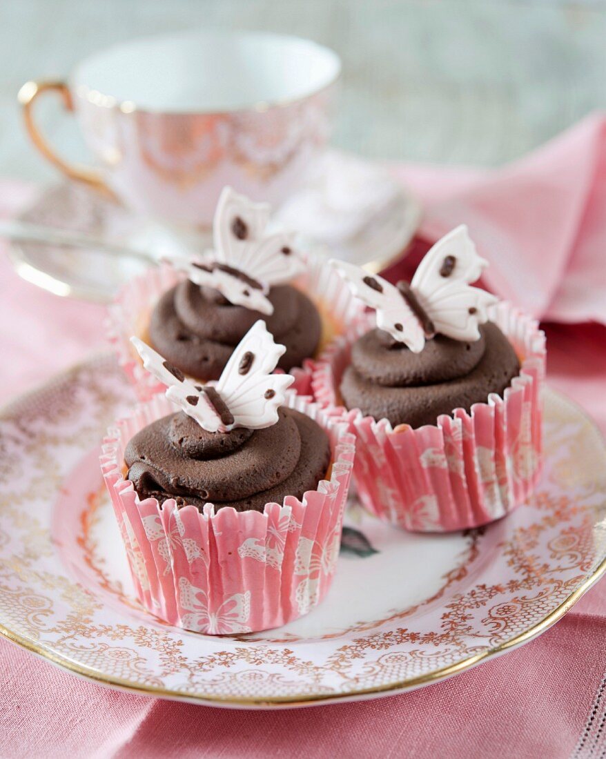 Dark chocolate cupcakes with fondant butterflies