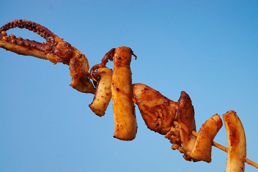 A squid skewer at a market in New York