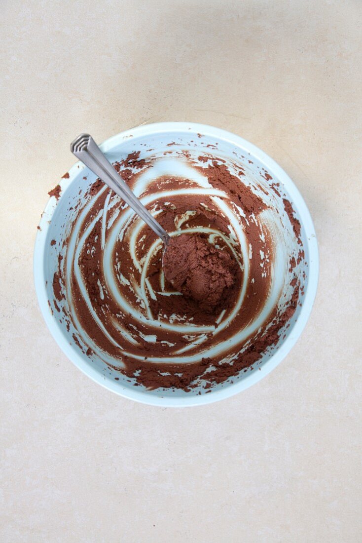 The remains of chocolate mousse in a bowl (seen from above)