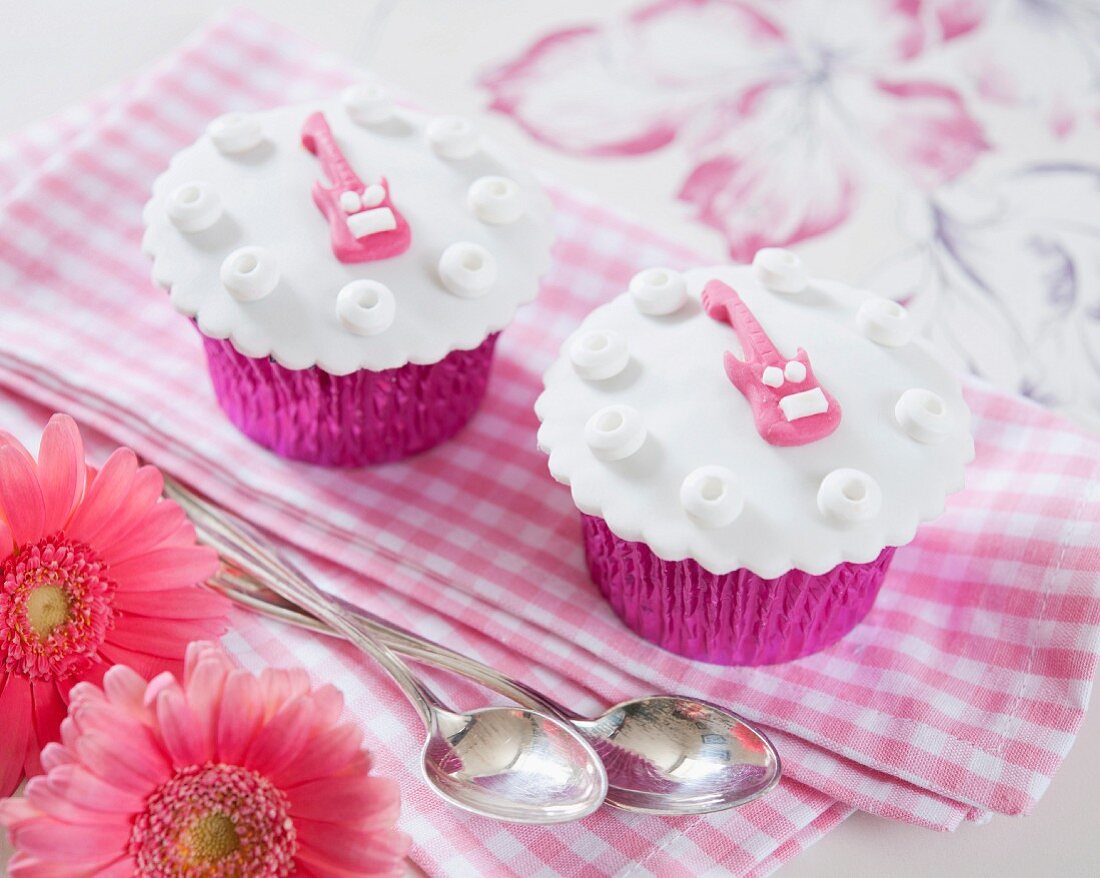Cupcakes decorated with pink guitars