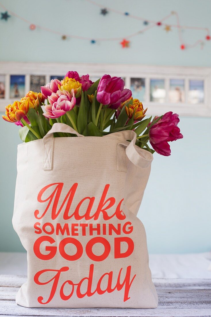 Tulips in shopping bag with printed motto