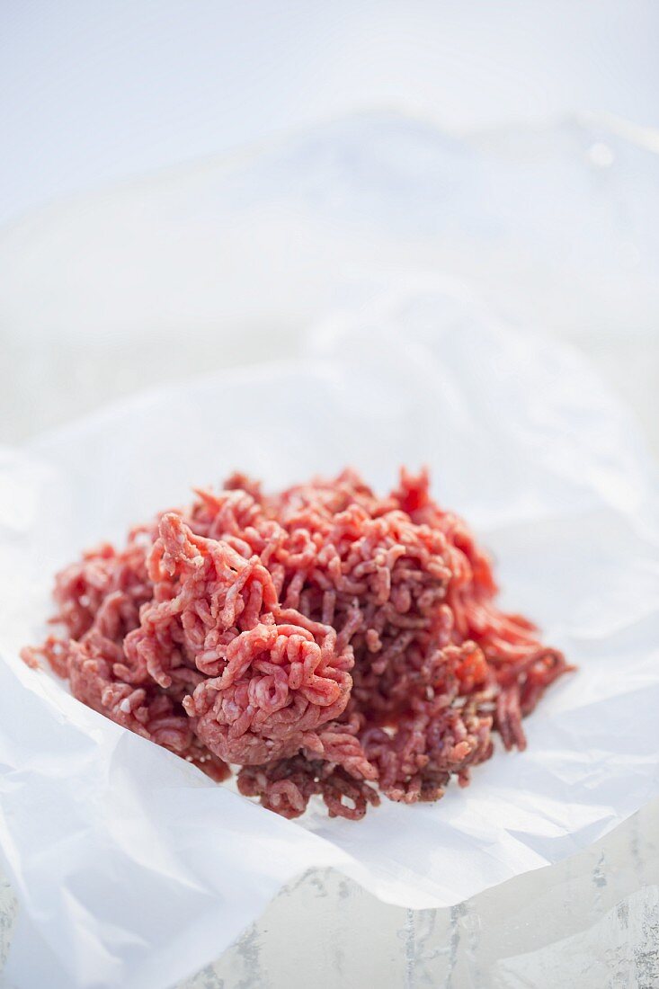 Fresh minced meat on a piece of paper