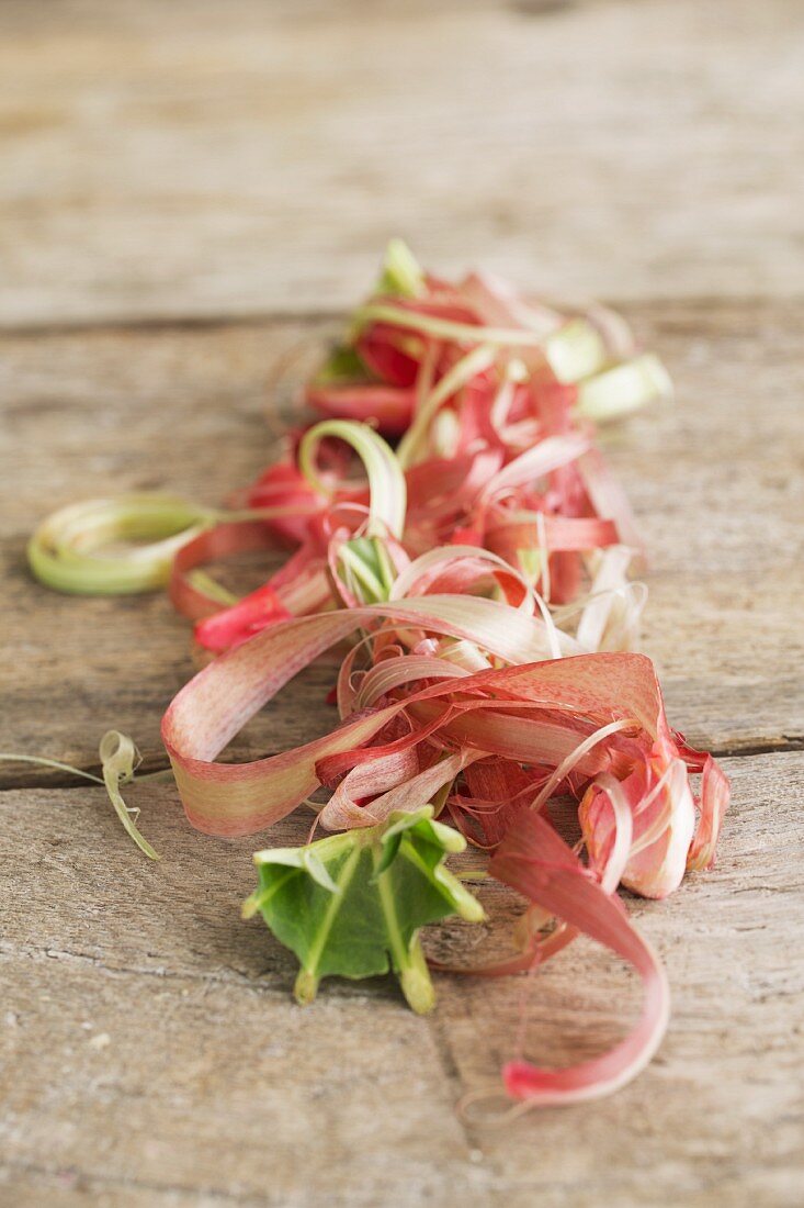 Rhubarb peel on a wooden surface