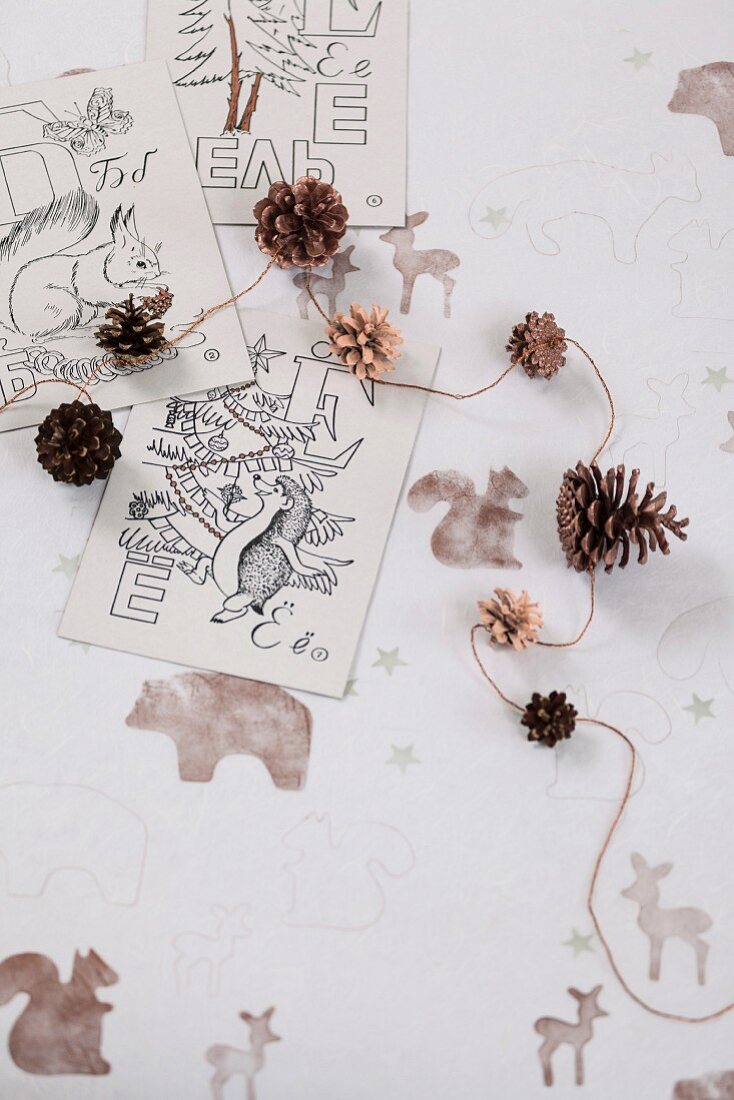 Decorative idea using pine cones and forest animal motifs