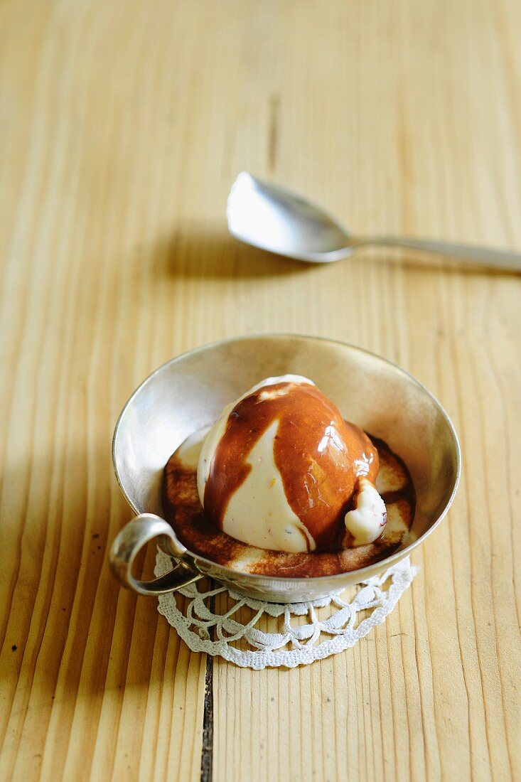 Peach ice cream with chocolate sauce