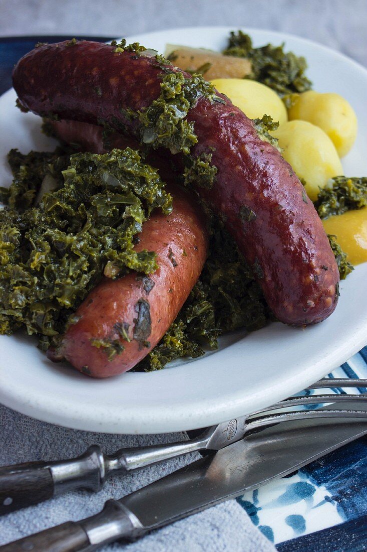 Pinkel (smoked sausage made from bacon, groats and spices) with kale and potatoes
