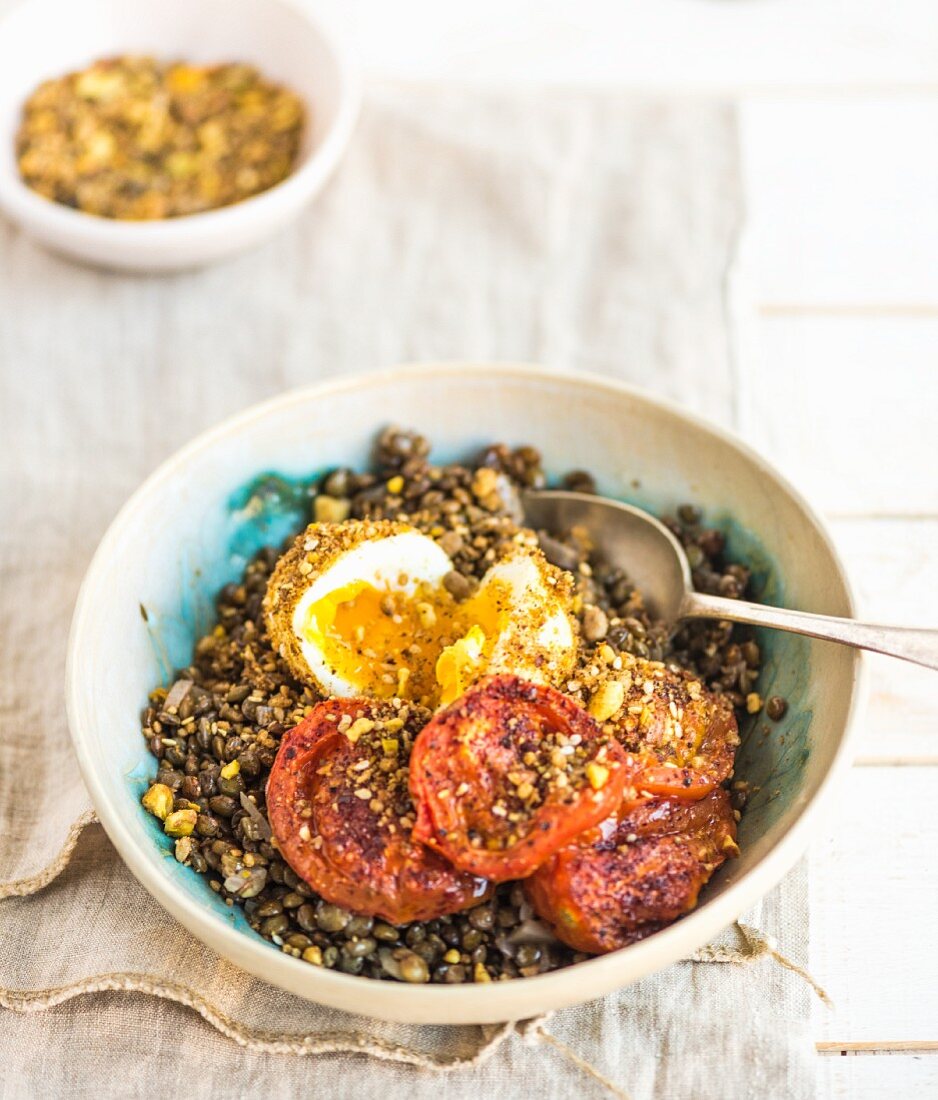 Sumac tomatoes on a bed of lentils with dukkah-coated eggs