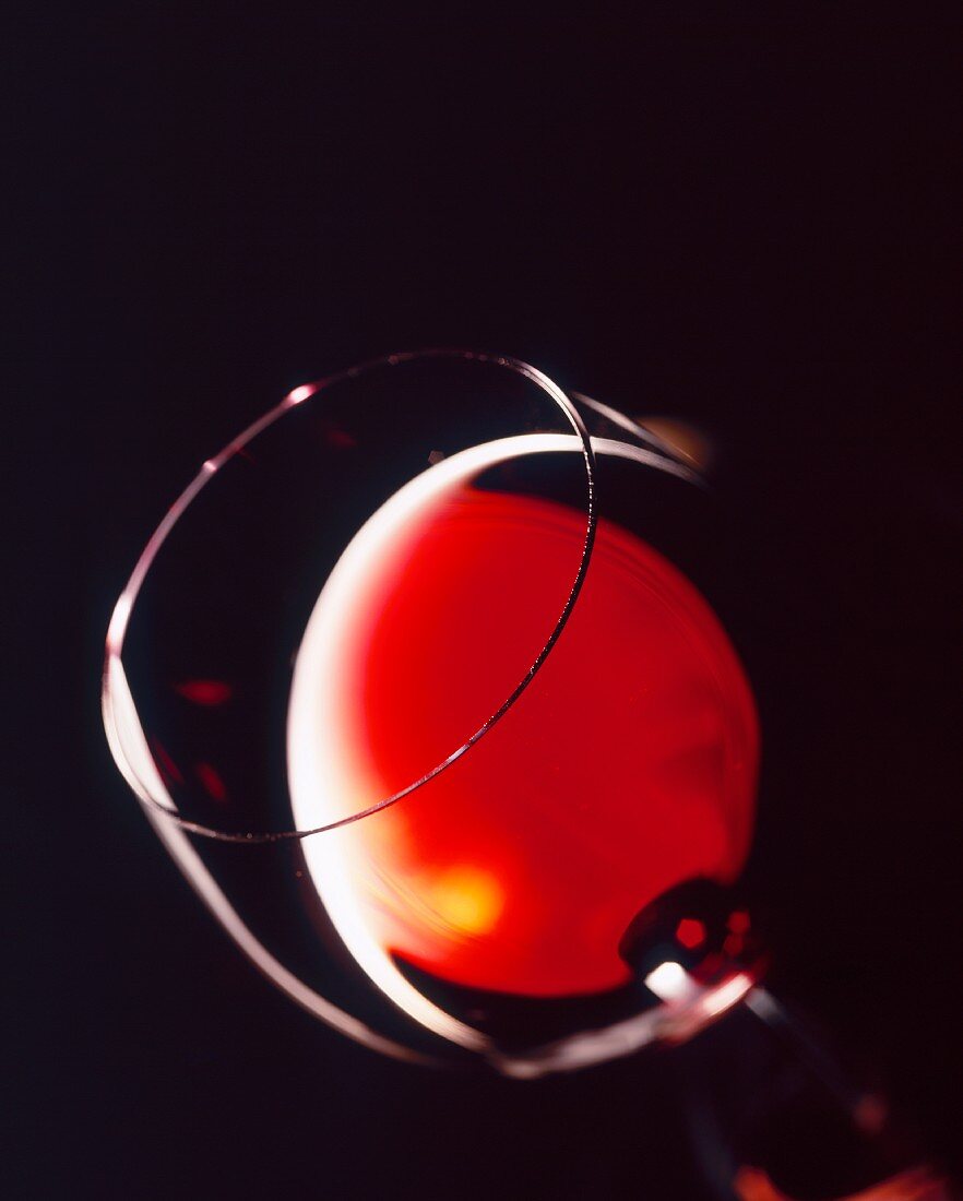 Tipped Glass of Red Wine