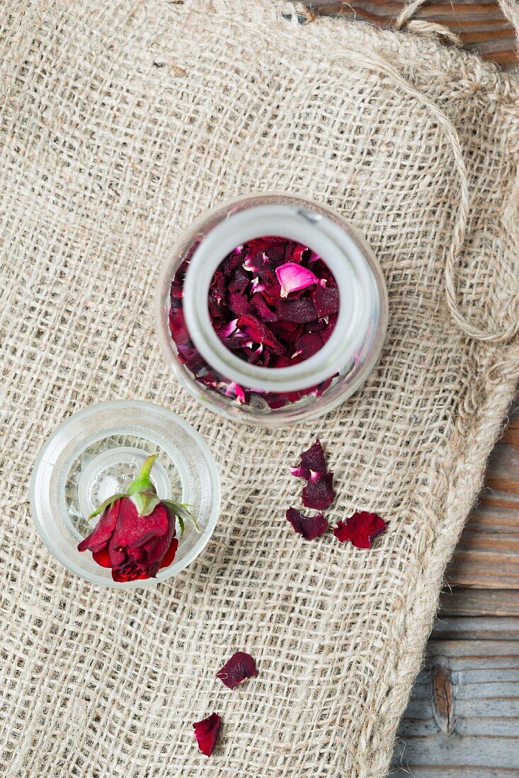 Dried rose petals in a glass jar (seen from above)