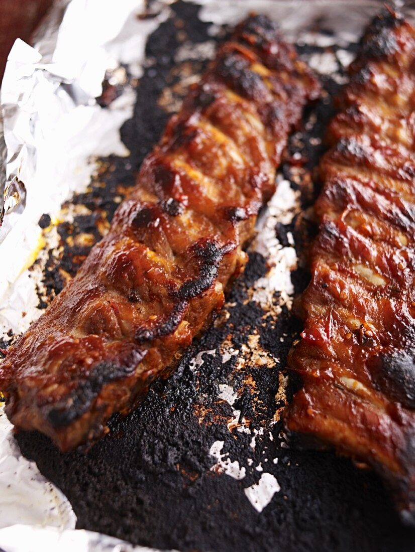 Oven-baked spare ribs on aluminium foil