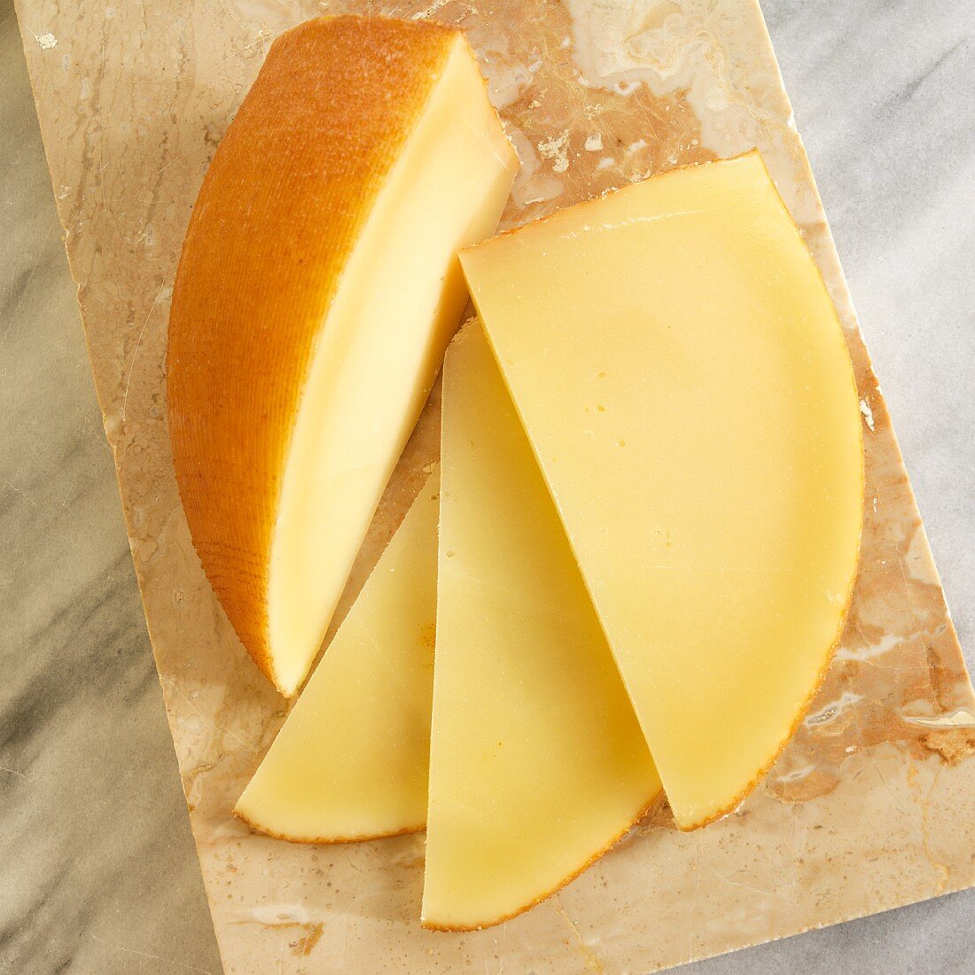San Simon cheese (smoked Spanish cheese) on a marble chopping board